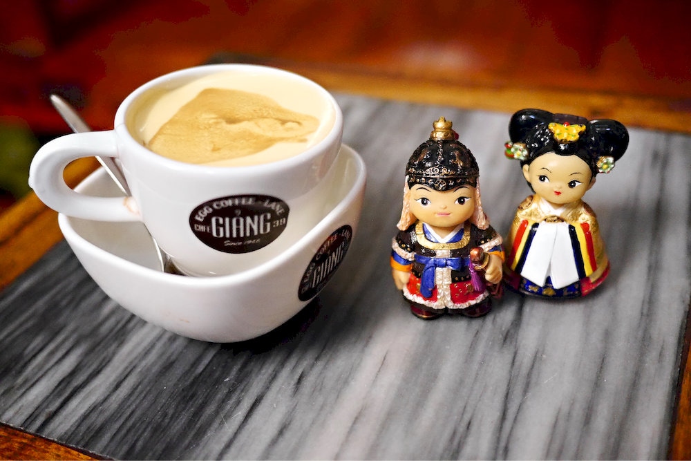 Egg coffee combines strong Vietnamese coffee with whipped egg yolk for a rich and creamy flavor unique to Hanoi 